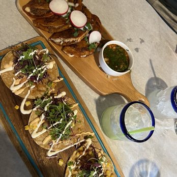 Tavo’s Signature Cuisine signature dishes Rib Eye Steak Tacos, House Shrimp Tacos, Elote, and their signature house-made Moles.